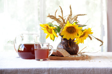  kvass (kvas) and a bouquet of sunflowers