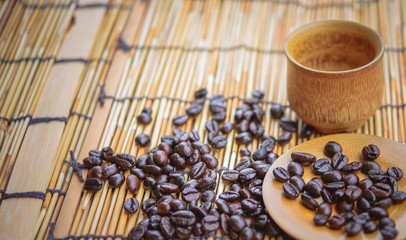 Photo in vintage color image style.Coffee beans and coffee cup s