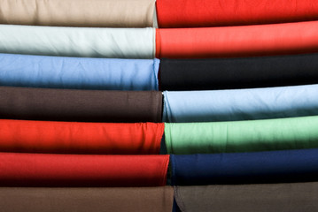 Close-up of colorful shirts at a drying rack