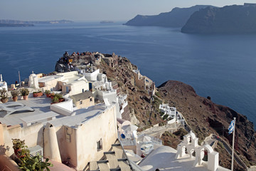View of Oia town and old castle of Oia, Santorini, Greece.