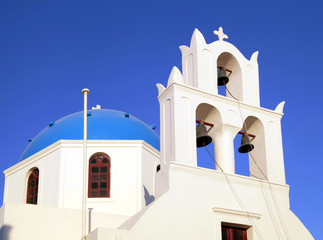 Fototapeta premium Blue dome greek orthodox church and belltower, Santorini, Greece