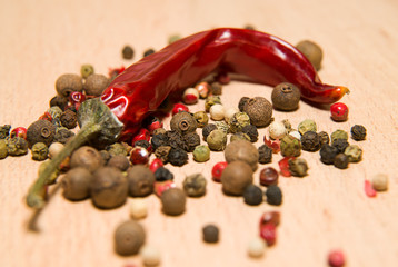 Chili peppers and beans mixture on a wooden surface