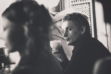Closeup portrait of elegant macho man with cup of coffee 