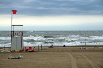 Lifeguard Tower on the beach with the sea very rough
