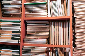 many books piled up for sale in the great library