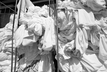 pile of dirty laundry in the industrial laundry before washing