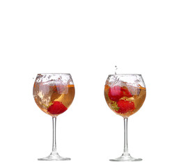 Single Strawberry splashing into a glass of wine