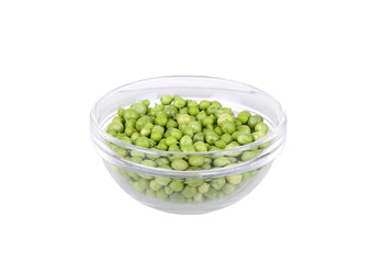 Fresh garden peas in a glass bowl.