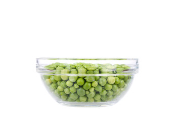 Fresh garden peas in a glass bowl.