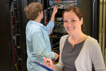 Two network engineers in server room
