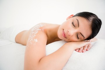 Woman sleeping with salt scrub on the back