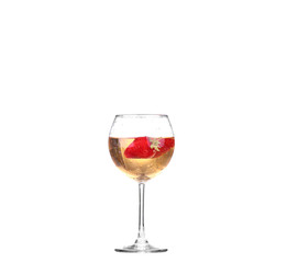 Single Strawberry splashing into a glass of wine