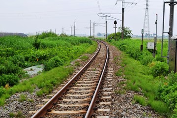 Fototapeta na wymiar 奥羽本線の線路（単線）／山形県の庄内地方で奥羽本線の線路（単線）を撮影したローカルイメージの写真です。
