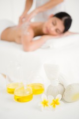 Obraz na płótnie Canvas Woman enjoying a salt scrub massage