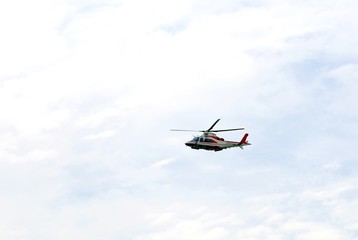 Fototapeta na wymiar great helicopter of fireman flies in the sky during an emergency
