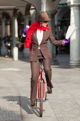 businesswoman with unicycle