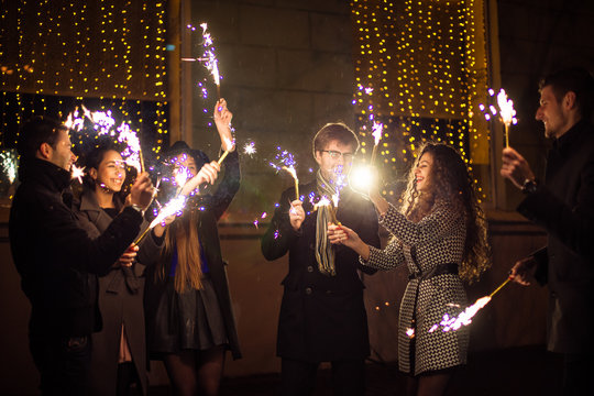 Friends with sparklers.