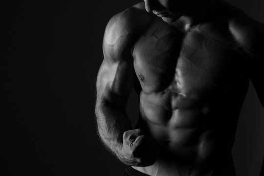 Man Flexing Biceps Sport Background