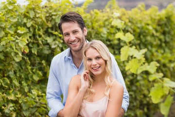 Young happy couple smiling at camera