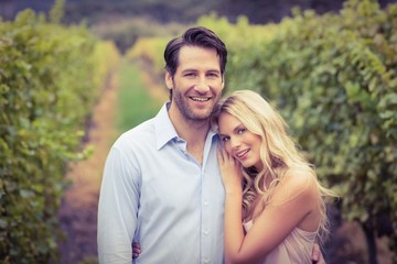 Young happy couple smiling at camera
