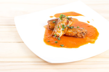 Canned fish in tomato sauce