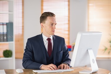 Focused businessman working at his desk