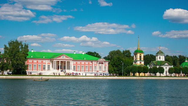 Vacationers go boating about Kuskovo palace. 