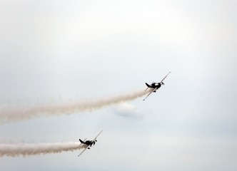 historic warplane with dark smoke from the engine malfunction