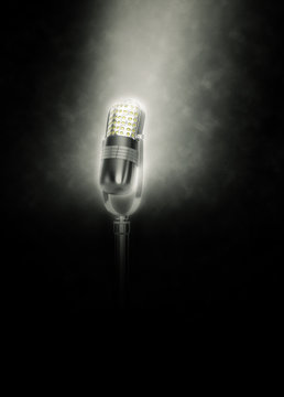Microphone on dark background lit from above