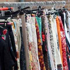 vintage clothes hanging in the open market of used things