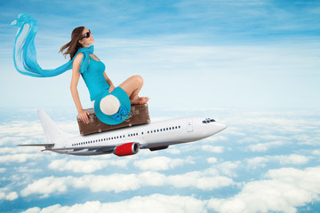 Fototapeta premium Young woman sitting on airplane