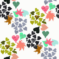 Background from multi-colored leaves on a white background. Seamless.