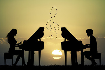 plays to piano at sunset