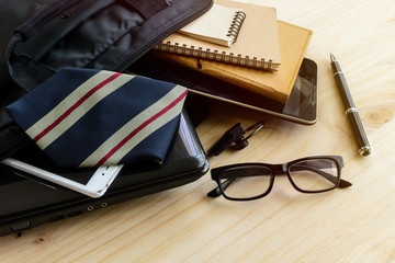 Businessman accessories and notebook bag on desk, Business conce