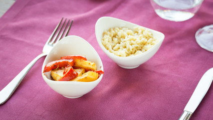 Selection of garnishes: sauteed vegetables and orzo rizotto