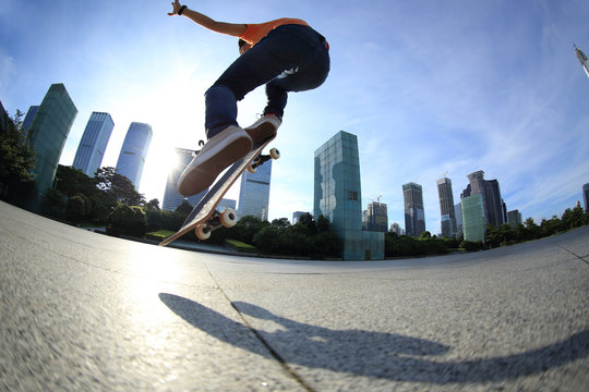 skateboarder skateboarding at sunrise city