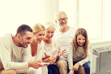 happy family watching tv at home