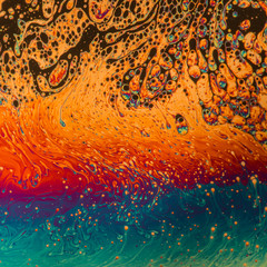 Psychedelic patterns formed on the surface of soap bubbles