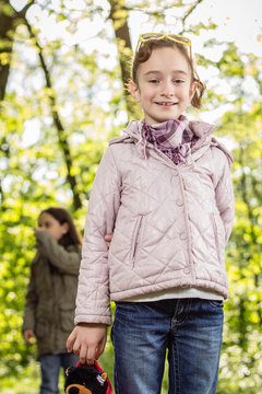 Photo of little girl posing in the park
