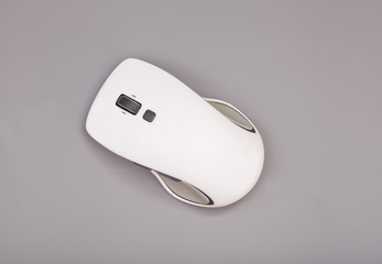 White computer mouse on gray background