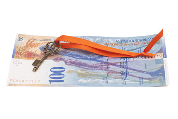 Key To Success With Red Bow on Swiss Franc note