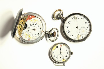 Old and damaged silver pocket watches.