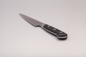 knife over gray background