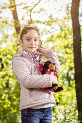 Photo of the little girl with a teddy bear