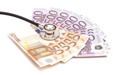 Euro banknotes and stethoscope