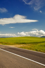 Fototapeta premium asphalt road in Tuscany hills, Italy