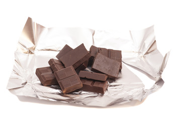 Broken chocolate on a aluminum foil