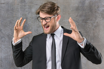Angry businessman screams