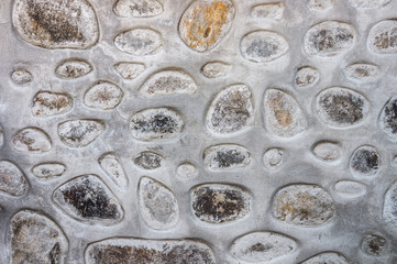 Rock and stone pattern on old concrete wall for background and texture