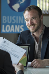 Caucasian male in a business loans office